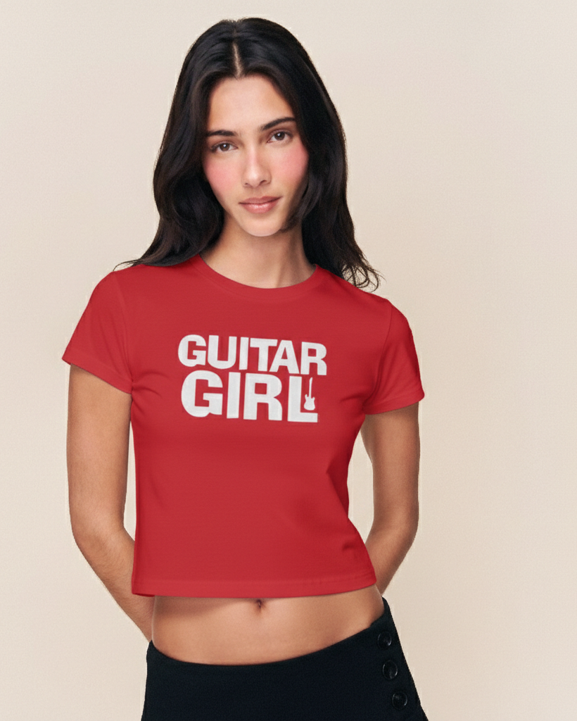 Woman wearing a red 'Guitar Girl' t-shirt against a beige background