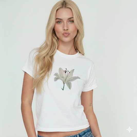 Woman wearing a white t-shirt with a floral design on a plain background